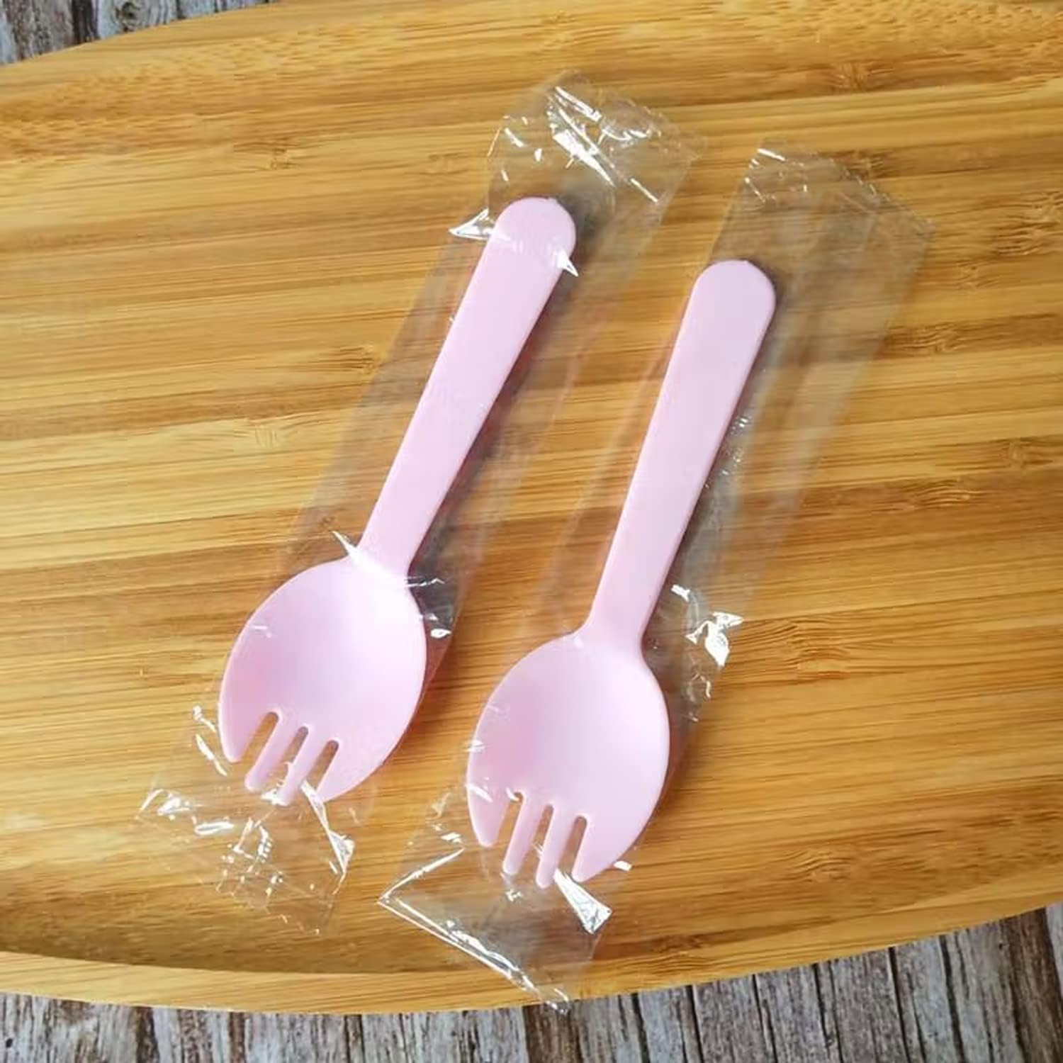 N-KONGJIAN disposable plastic sporks front view showing pink 2-in-1 design.