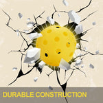 AMYPUK yellow pickleball close-up of drilled hole pattern