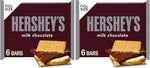 Stack of six individual Hershey's milk chocolate candy bars illustrating the full pack volume.