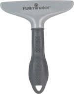 FURminator grooming rake removing loose pet hair