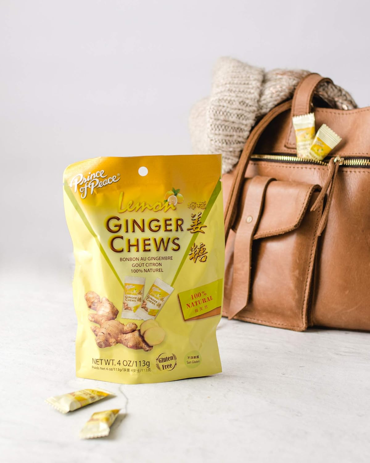 Close up view of a single chewy lemon ginger candy piece showcasing its texture