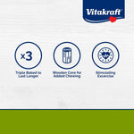 Vitakraft small animal crunch sticks attached to a wire pet cage via the built-in clip holder