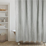 Hall And Perry Modern Transitional Stripe Shower Curtain front view displaying elegant vertical black and cream lines hanging in a brightly lit bathroom setup.