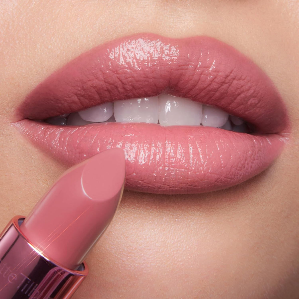 Luxury hydrating lip color swipe on neutral background