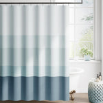 Jinchan ombre ocean blue striped shower curtain front view hanging in a modern minimalist bathroom