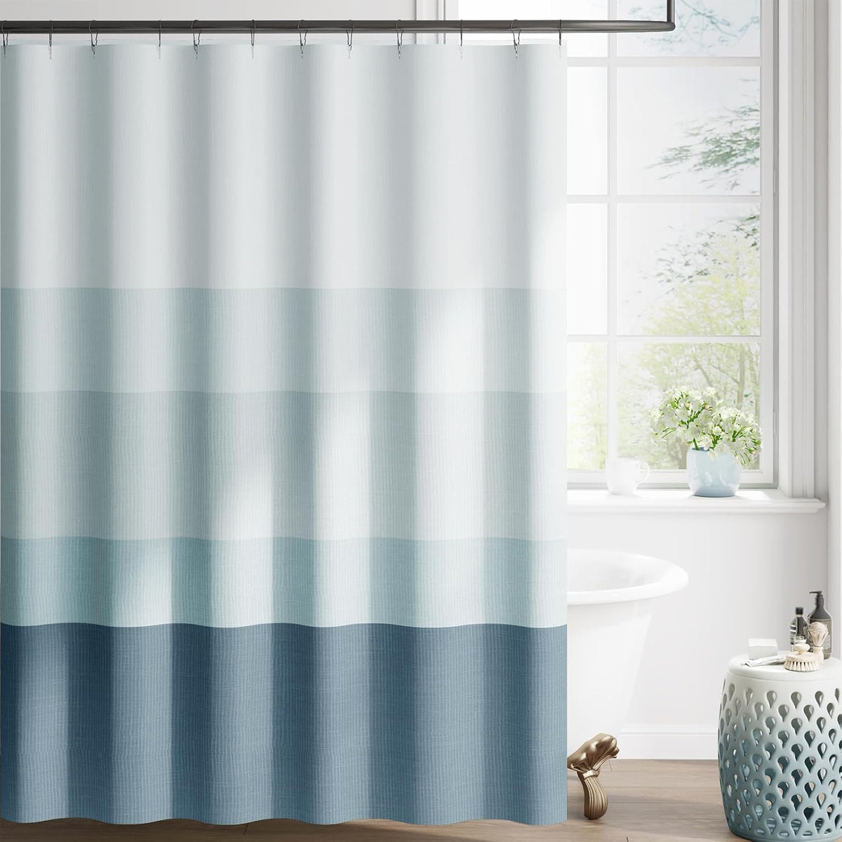 Jinchan ombre ocean blue striped shower curtain front view hanging in a modern minimalist bathroom