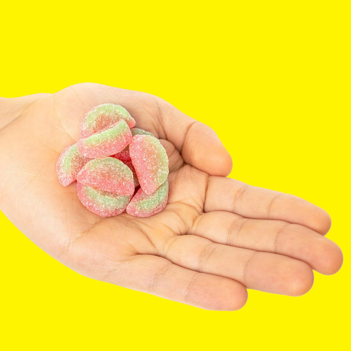 Sour patch kids watermelon chewy candies in a clear glass bowl
