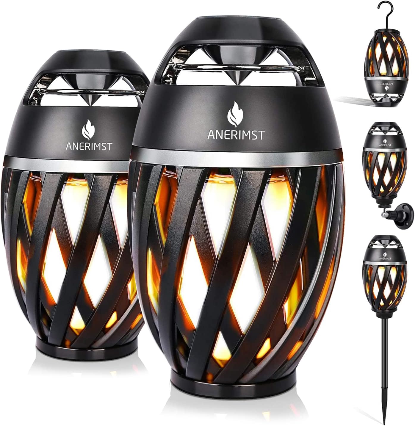 ANERIMST outdoor bluetooth speakers front view showing dual pack with flickering led flame lighting effect on a dark patio table.