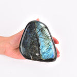 Jic Gem healing crystal held in hand for scale and texture.