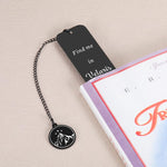 Dark romance bookmark featuring mountain and star charm detail close up