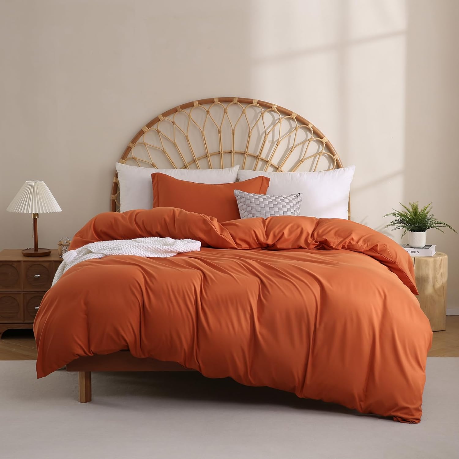 JSD Burnt Orange Duvet Cover Set twin size laid out on a kids bed showing the vibrant solid terracotta rust color front view
