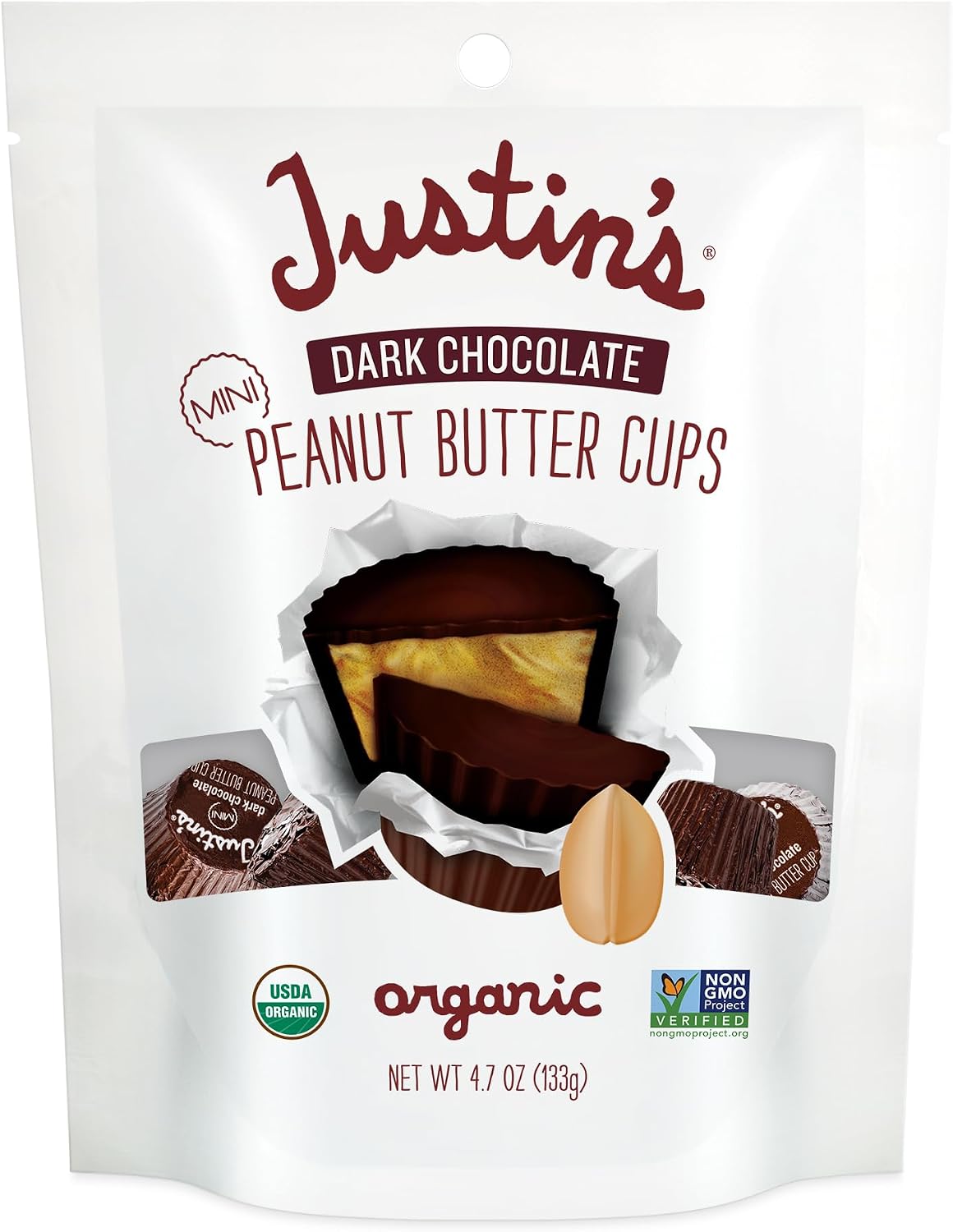 Close-up of a bite-sized Justin's mini cup showing the creamy peanut butter filling