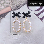 Zeshimb cubic zirconia crystal earrings worn by model