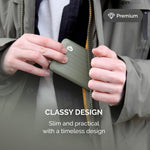 Compact green aluminum card case fitting easily into a trouser pocket