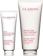Clarins hand and nail treatment cream and moisture rich body lotion bundle front view skincare set