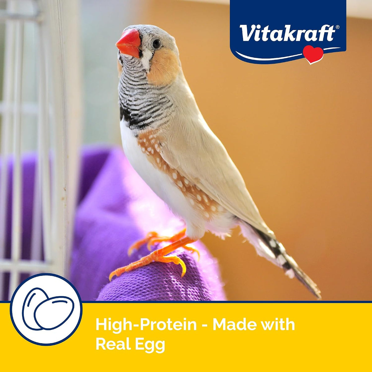 Happy parakeet eating Vitakraft VitaSmart supplement