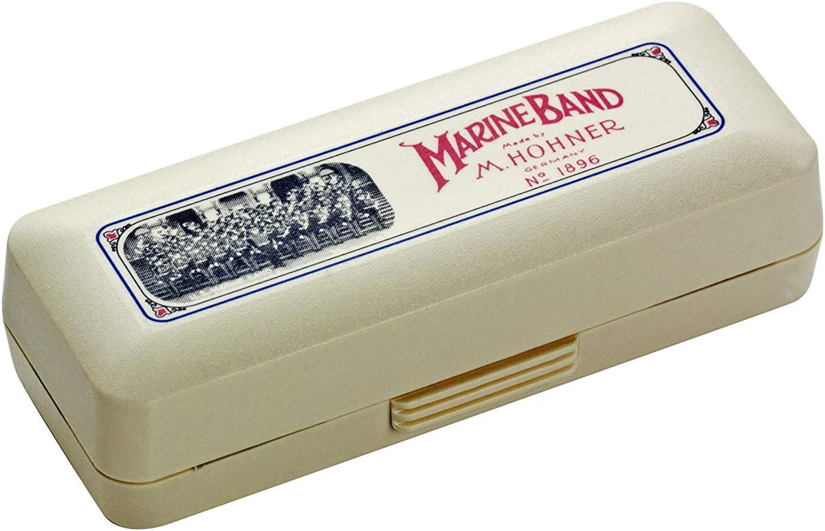 Hohner Marine Band harmonica in key of G displayed with its protective storage case.