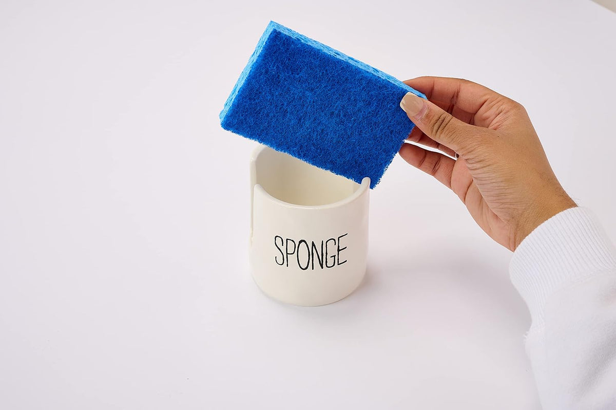 Mud Pie kitchen sponge holder styled on a marble countertop
