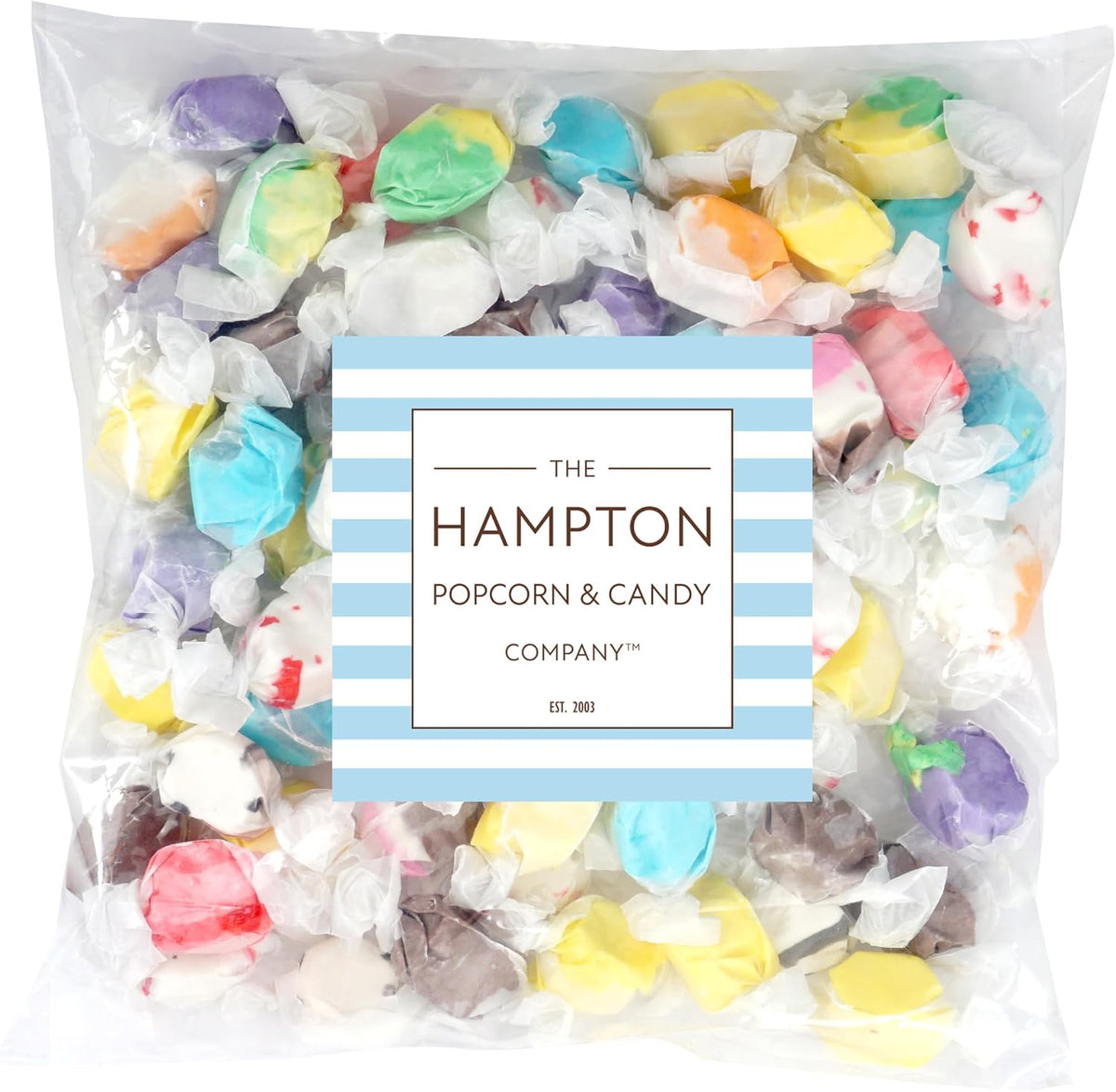Assorted flavors salt water taffy candies spread out individually wrapped