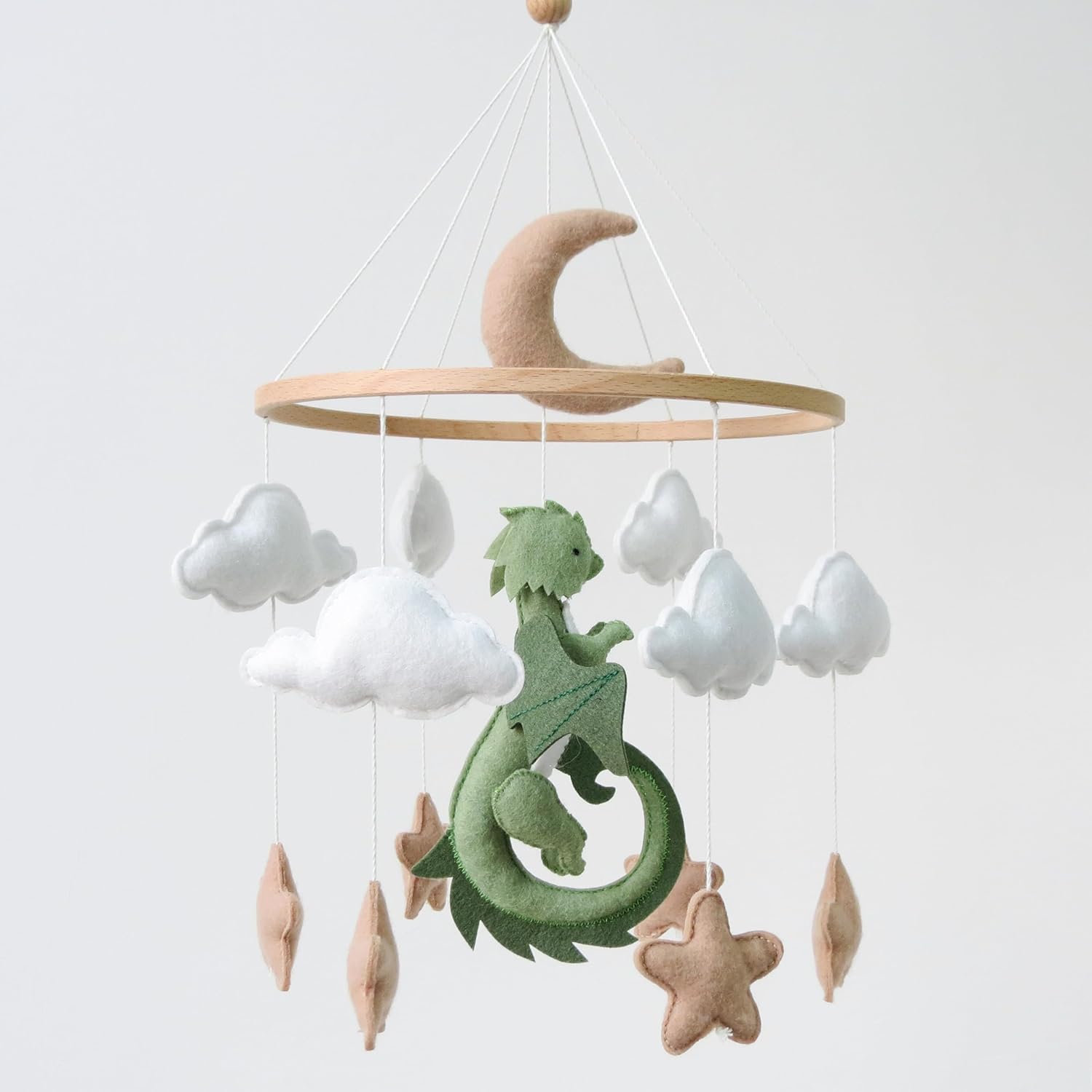 Goukurlsma dragon mobile for crib front view featuring green felt dragons and white clouds.