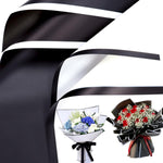 Foimas flower wrapping paper front view showcasing black and white sheets.