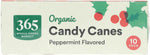 Dye free peppermint candy canes individually wrapped next to hot chocolate