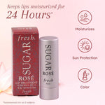 Fresh Sugar Rose Lip Treatment tube opened showing sheer pink tint