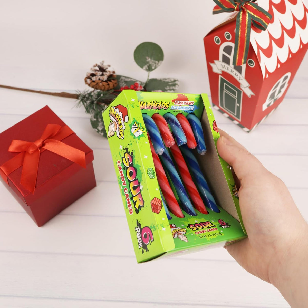 Individually wrapped blue and red sour candy canes for Christmas tree decoration.