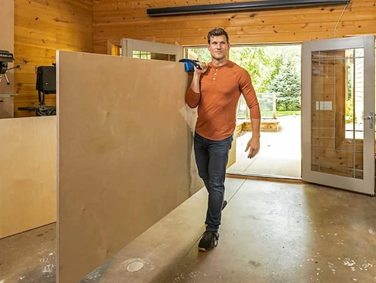 Demonstrating one-handed lifting with Kreg panel carrier