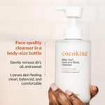 Dermatologist tested Cocokind ceramide milk cleanser placed in a modern bathroom setup.