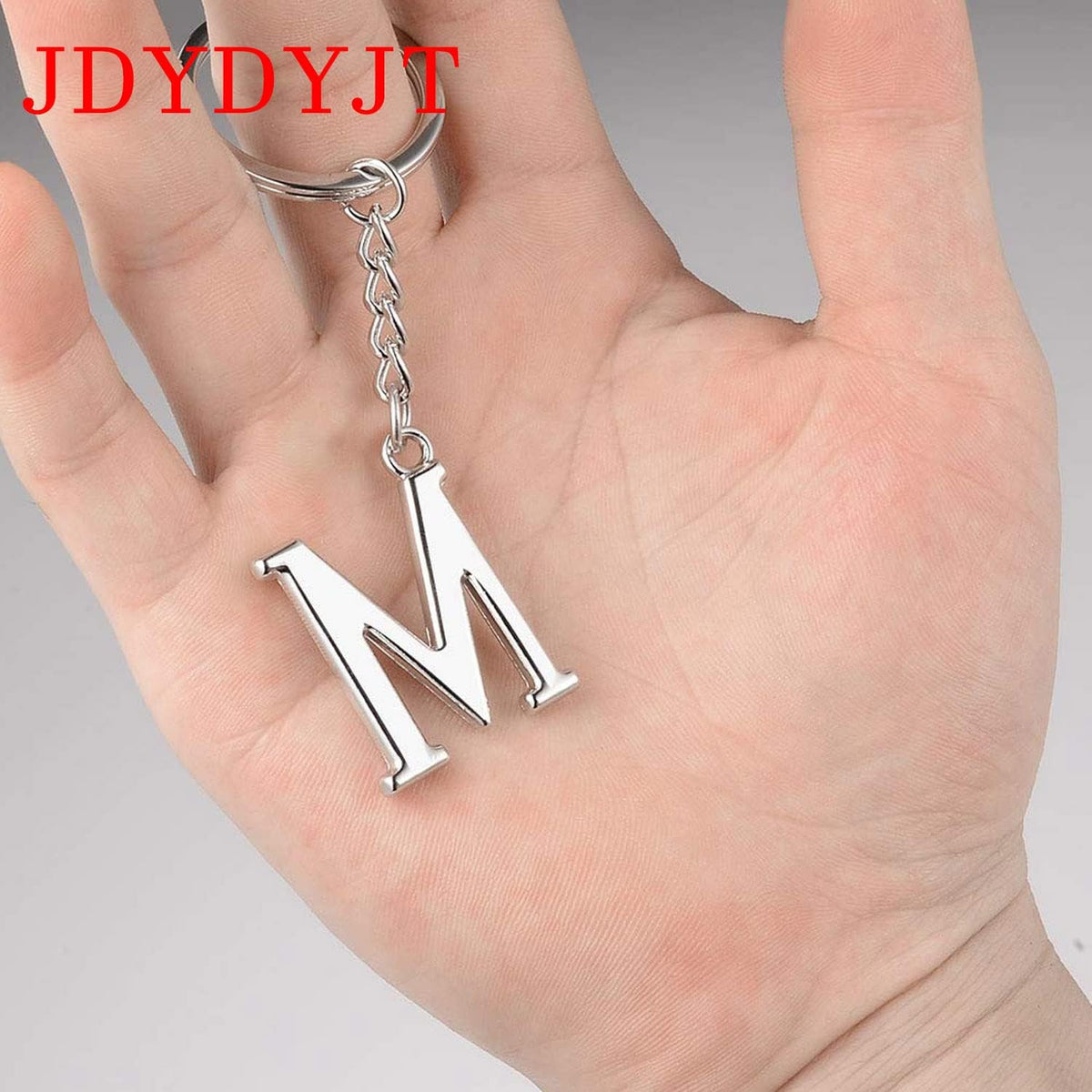 YJT alphabet letter key chain flat lay