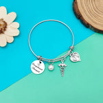 Dabihu graduation gift bracelet displayed with included velvet bag