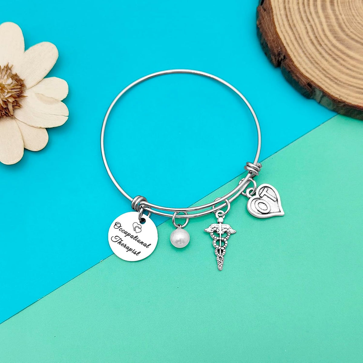Dabihu graduation gift bracelet displayed with included velvet bag