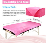 Pink disposable spa bed sheets stacked in bulk