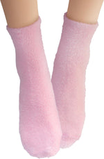 Side angle view of pink Earth Therapeutics therapeutic foot socks