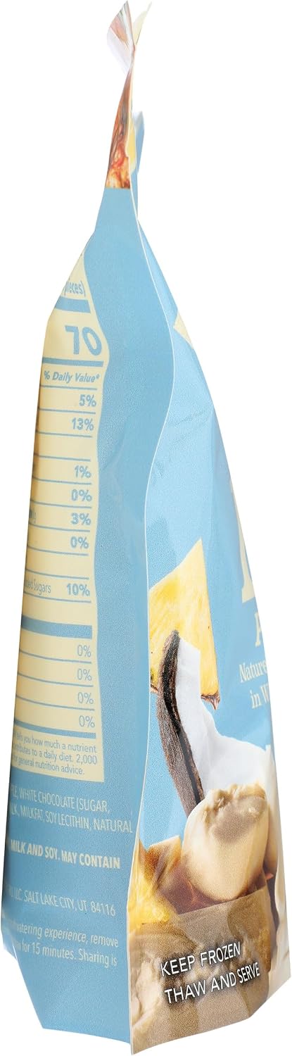 Tru Fru pineapple snack bag next to fresh coconut and pineapple slices