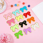 Assorted color bow patches arranged together in a 12-pack set