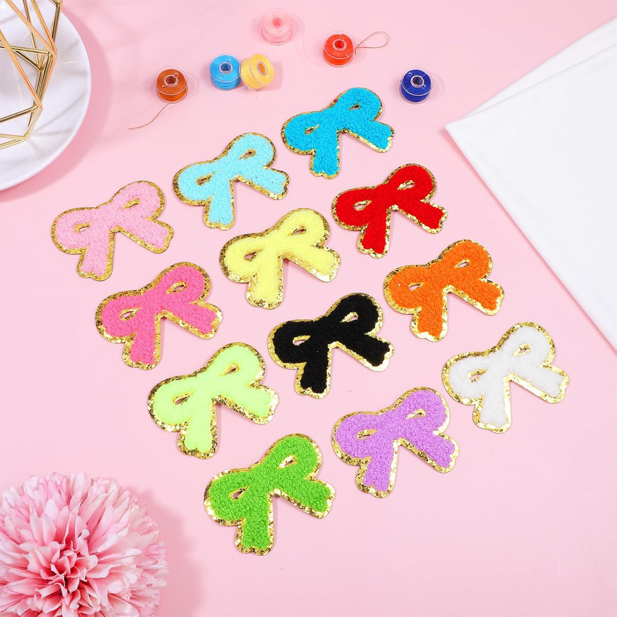 Assorted color bow patches arranged together in a 12-pack set