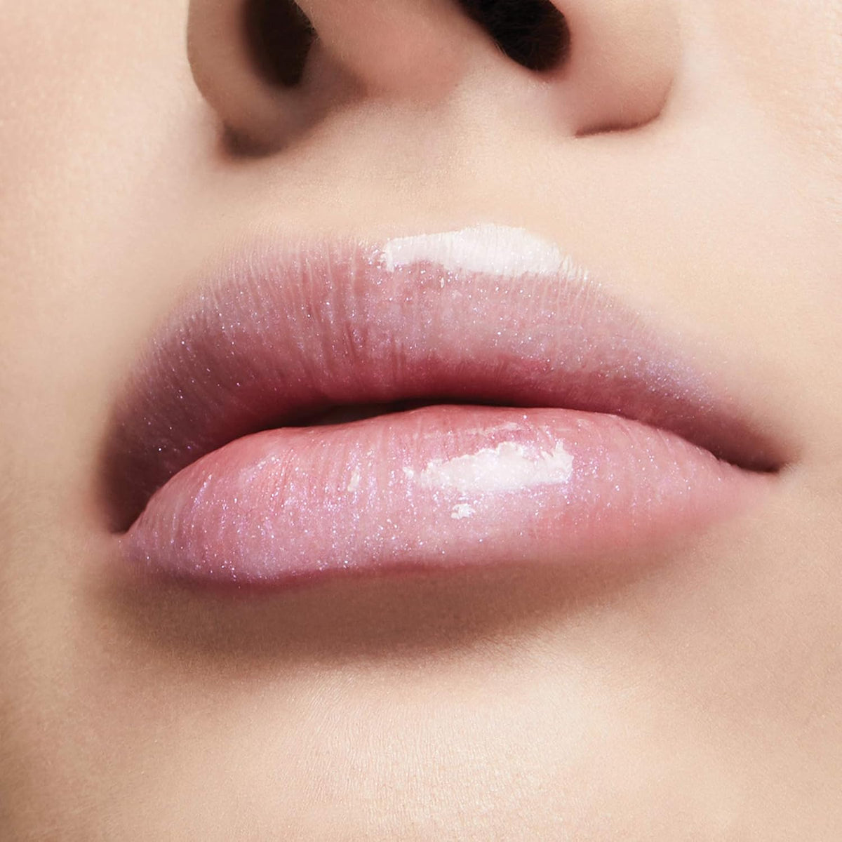 High shine volumizing pink lip gloss for intense hydration and conditioning