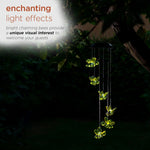 Multicolor LED lighted bees glowing in dark garden setting