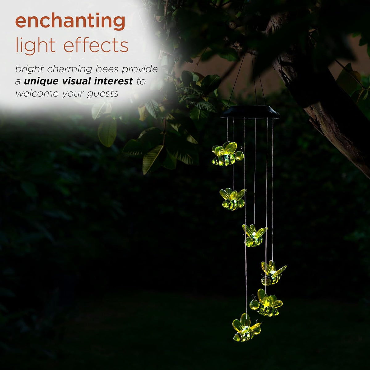 Multicolor LED lighted bees glowing in dark garden setting
