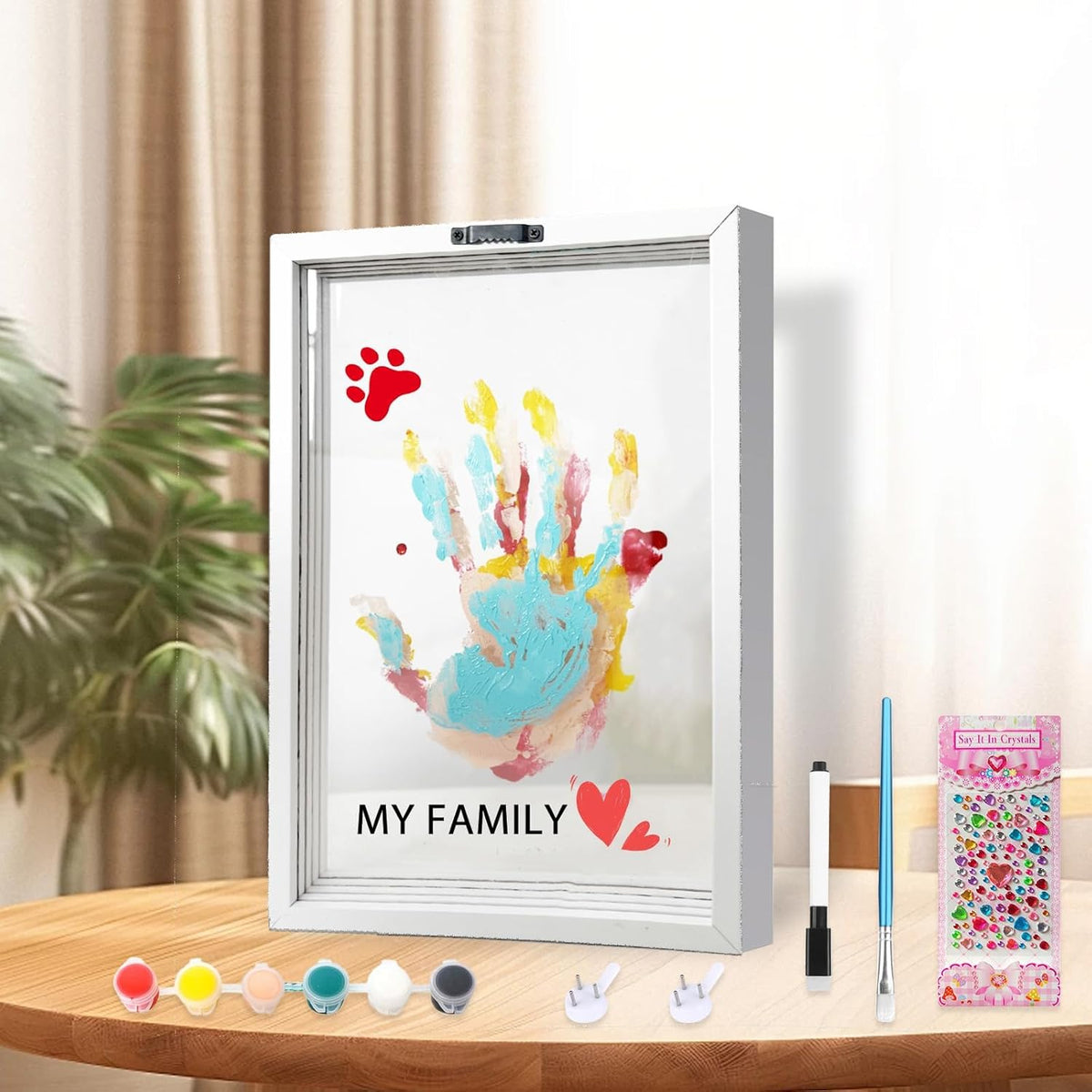 XQC Family Handprint Kit front view of white wooden keepsake frame with colorful layered handprints