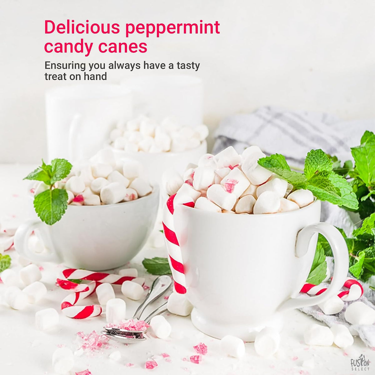 Individually wrapped mini peppermint candy canes spread out for Christmas party decorations.