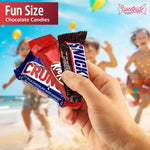Five pound office candy assortment spread out showing a variety of chocolate shapes and flavors for party hosting.