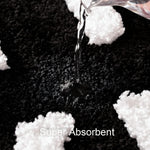 Close up of soft microfiber shaggy texture and white tufted lettering