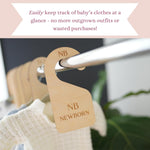 Wooden nursery closet organizers displayed on a rod