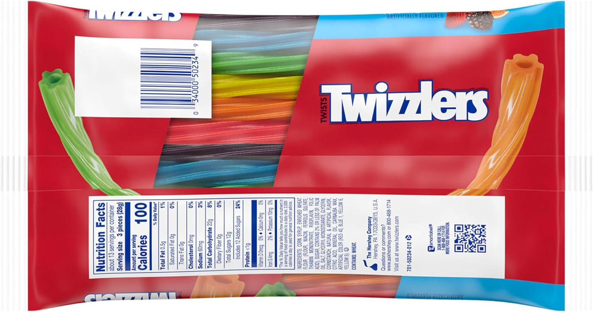 Vibrant six-flavor TWIZZLERS Rainbow Twists spread out showing strawberry, orange, lemonade, watermelon, grape, and blue raspberry colors