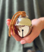 LilyDeal silver sleigh bell with leather strap and red and white box