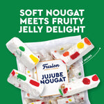 Creamy white milk nougat candy with visible fruit jelly pieces