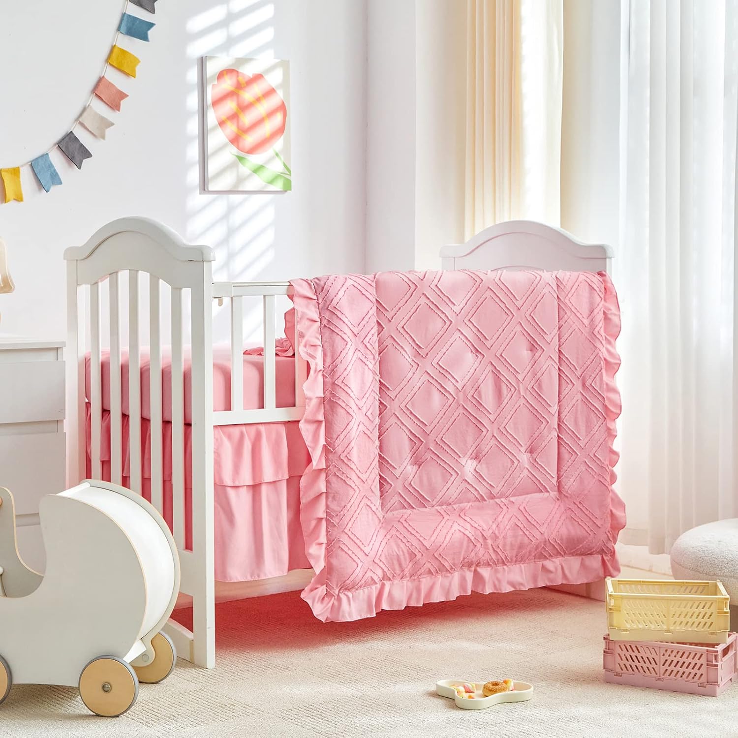 Uozzi Bedding Tufted Ruffle Crib Bedding Set front view featuring pink quilted comforter on a baby mattress.